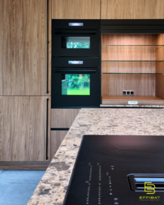A view of the kitchen with wood details