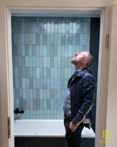James inspects the sky light in his new bathroom