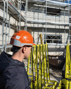 Sylvain looks over the worksite from the ground