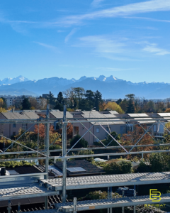 A view of the jagged teeth of the Alps as seen from the building rooftop
