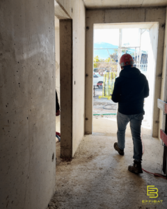 Sylvain walks through a corridor in the new building
