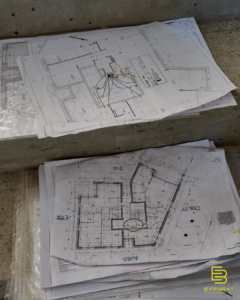 Paper plans show where all the electricial wiring should go