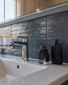 Darker clay tiles adorn this bathroom's walls