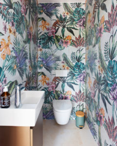 A bathroom with colorful jungle tiles